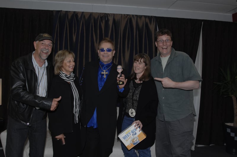 Richard Taylor presenting a gift to Elton John backstage in New Zealand.