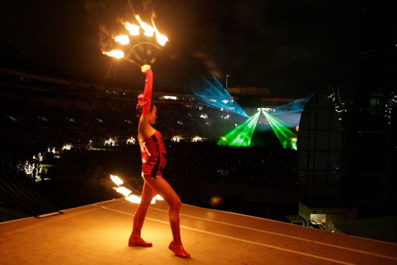 Fire dancer performing with laser effects at Rock2Wgtn at Westpac Stadium in Wellington.
